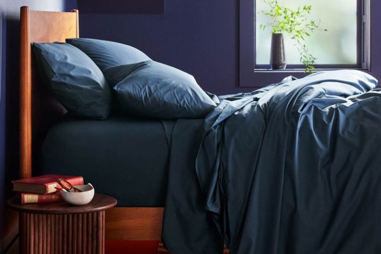 Credit: Brook Linen, navy sheets