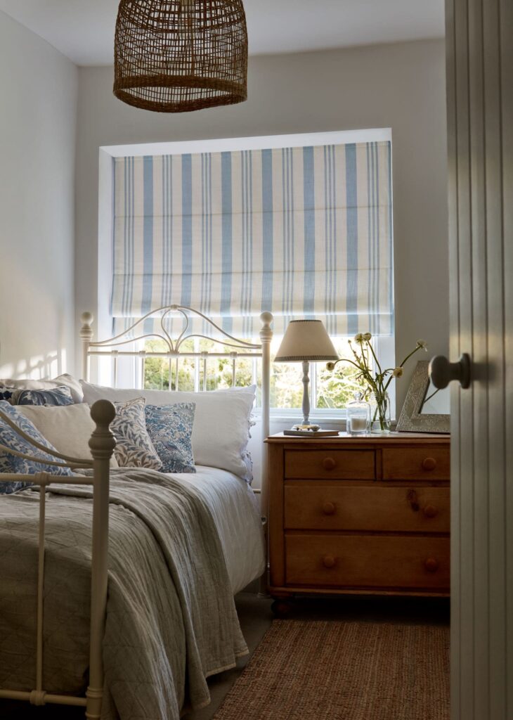 striped roman shades in balanced ice